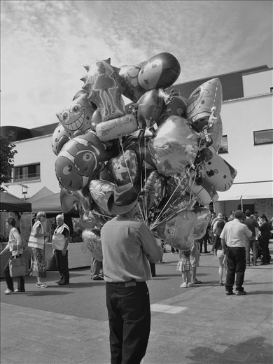 Balloon seller at the annual Puck Fair. August 2013, Killorglin, Ireland