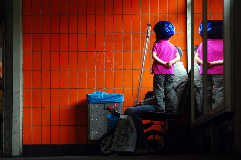 A little girl waits for the U-Bahn in Berlin, Germany