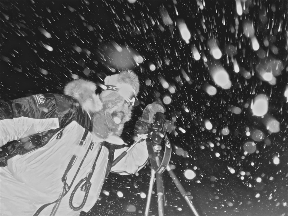 This photo was taken outside at -80 degrees Celsius in 10 metres per second winds.

Before I went to Antarctica, I spent my last doctors paycheck on a Canon 5D Mark II body.  Sigma then supported me by means of the loan of various lens.  I read the operating manual for my Canon which advised not to use the camera so far below zero.  I am interested and used to working at extremes and testing technology to discover its limitations to help find ways to improve function in all conditions.  As it turns out, my Canon body and Sigma lens continued to operate and perform through all year round use outside in temperatures from -25C down to -80C (with -110 Celsius windchill).

The other main consideration with working in such low temperatures is protecting your own safety.  If you take your thick cumbersome down glove off in -80C, your flesh will start to freeze within minutes.  But, in order to change your camera's settings, you have to take your glove(s) off.  So you adapt.  Also digital photography now allows you to quickly learn what settings you need to use.  Preparation is prevention.  And prevention means you get to keep all your fingers!    

I look at this photo and it reminds me that I am grateful to be able to type this for you.