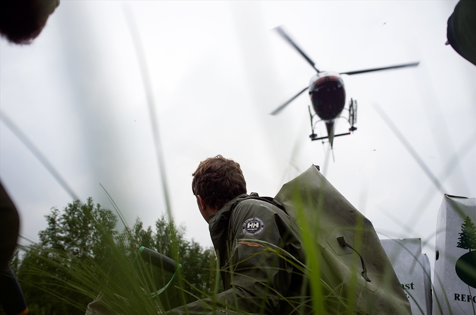 A tree planter awaits his lift in the cold