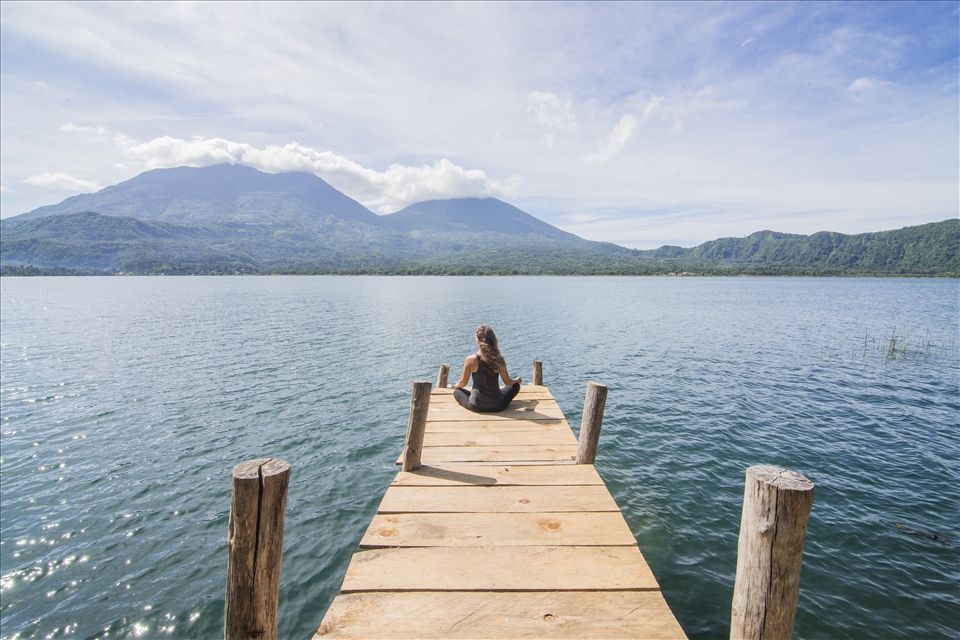 Morning meditation on the dock of the Mystical Yoga Farm.  