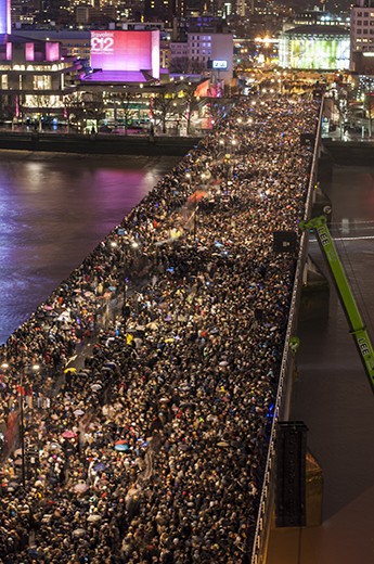The Battle of Waterloo
With midnight fast approaching we decided it best to find a good viewpoint to watch the show. Of course, trying to get anywhere in London - even at the best of times - is a mission in itself. Thanks to a bit of research and planning we quickly came upon a set of stairs in a back alley and, after waiting for the right moment, ascended above the crowds on the street. After many flights of stairs we found ourselves on the roof of the Savoy Hotel with a wonderful view of Waterloo Bridge (so packed with people that I thought it might collapse), huge amounts of boats on the Thames, The Houses of Parliament, The London Eye and Millennium Bridge. We were ready to enjoy the show.
