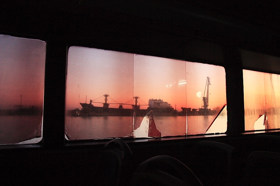 Two cargo ships wait in the local shipyard to be dismantled and sold. Sulina, Danube Delta, Romania