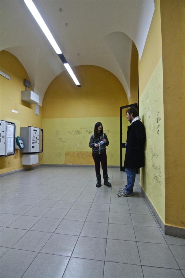 After a long day exploring the beautiful coastline of Polignano, we found ourselves waiting for a train for three hours in a completely empty station. The waiting room pictured here was quite unique, with no chairs, an old ticket machine, graffitied yellow walls, and superb acoustics. 
