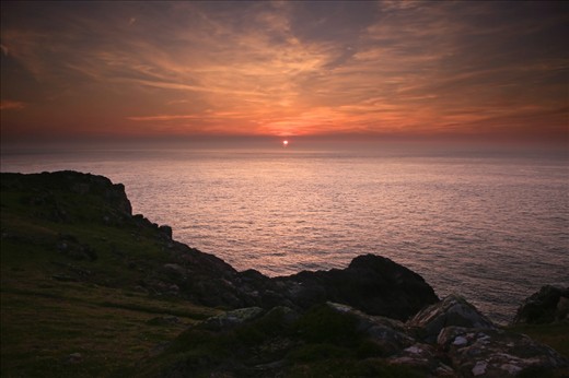 Looking west from the cliff top as the sun was setting was spectacular. The sea looked like an ice field stretching for miles into the horizon, which was glowing a pale red reflecting the beautiful colours of the sky. 