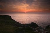 Looking west from the cliff top as the sun was setting was spectacular. The sea looked like an ice field stretching for miles into the horizon, which was glowing a pale red reflecting the beautiful colours of the sky. : by alfiealf, Views[490]