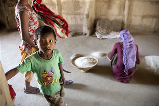 Modern video game on the shirt of this boy living with 31 family members. 