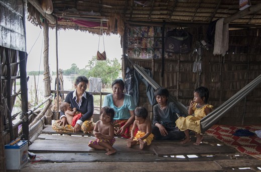 One of Lake Tonie Sap resident family in a makeshift hut on top of the water.