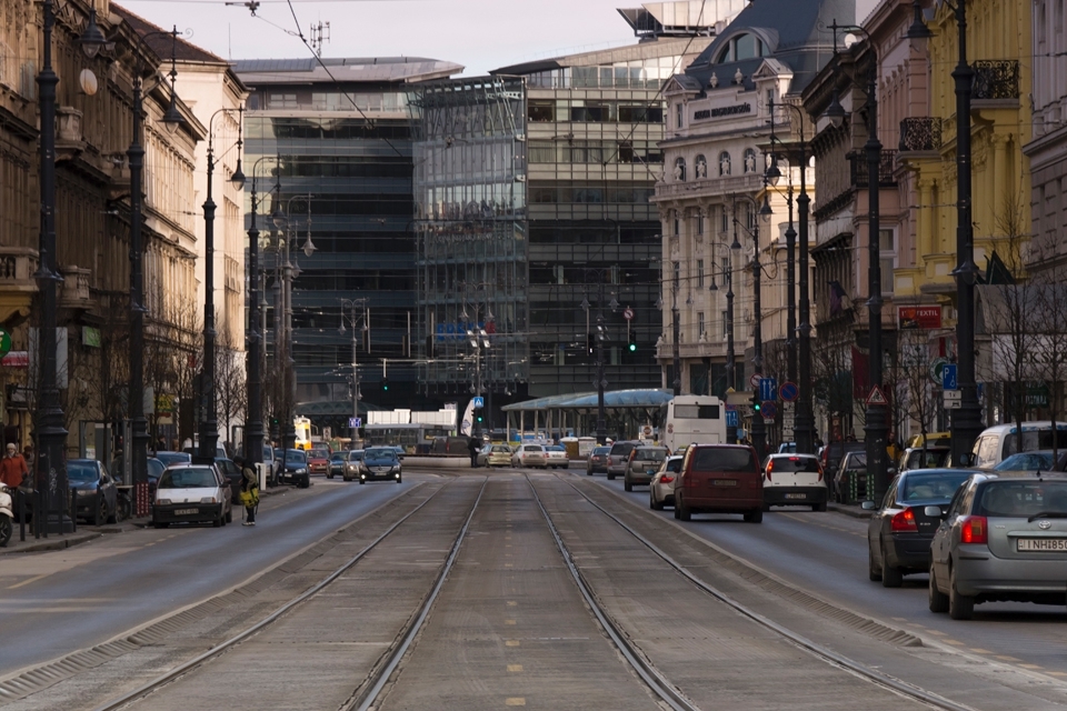 The road to Calvin Square, Budapest, where old few story buildings collide with large glass architecture.