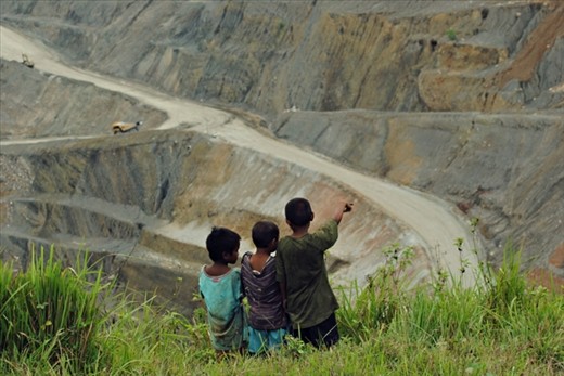 Less fortunate kids eyeing for a playground site in the copper mine haul roads.