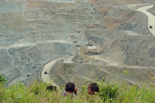 From a hill, young eyes looking at a grand view of an open-pit of the Philippines’ largest copper mining site. 