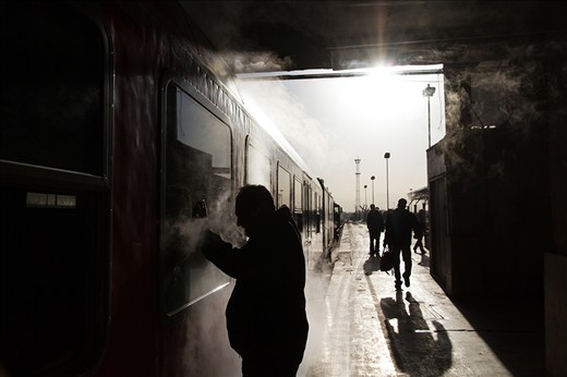 A man is bidding farewell to his family behind a train window as the train is waiting in Tehran’s main train station and is about to set off to Mashhad on a mild winter morning. Oddly for any public place in Iran, photography is often times allowed in and outside trains. 