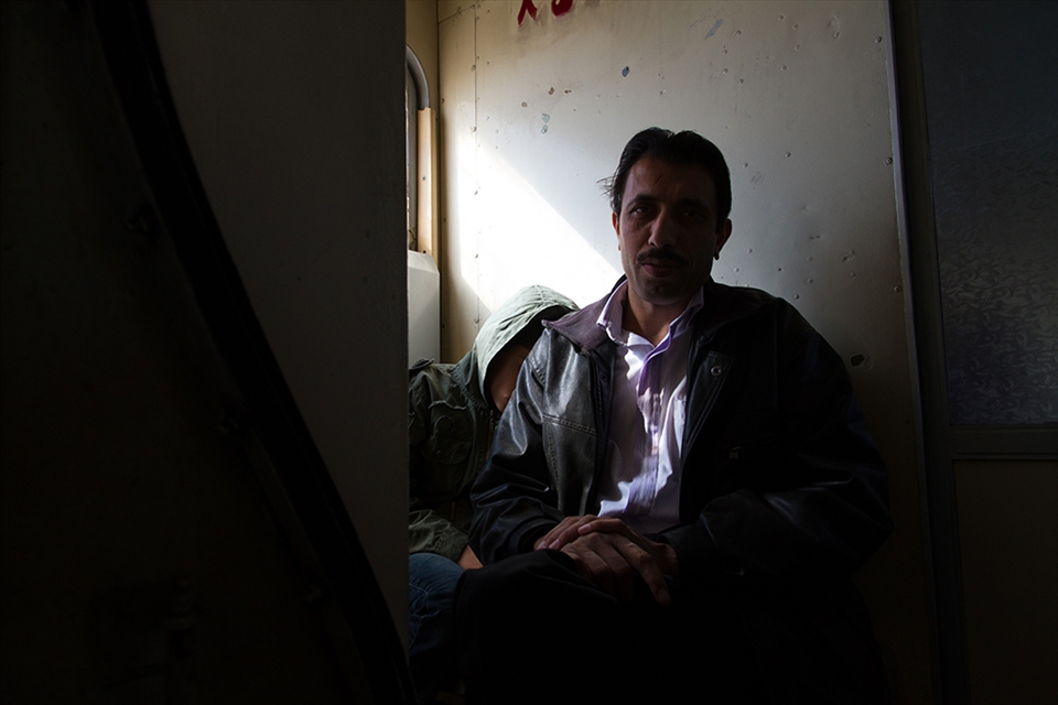 A man and his son have no tickets and have to sit in the cramped head area of the wagon next to the toilet. Second and third class wagons/trains are anything but comfortable even for the passengers with tickets. 