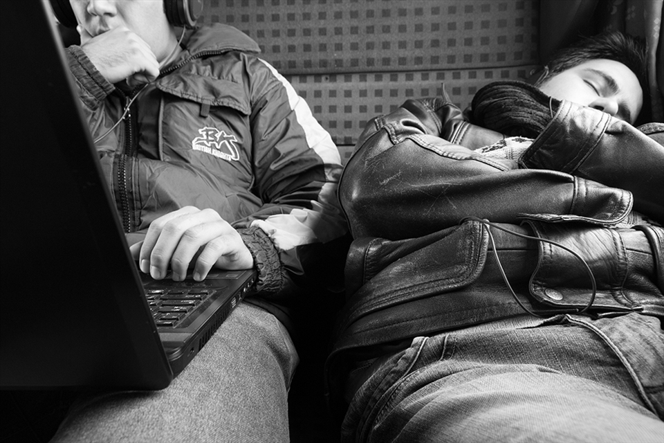 Two students are travelling on a ‘second class bus wagon’ on a cold winter day. They are not related to each other. The wagon is yet to become warm as the air condition was out of order for a few hours in the freezing morning.
