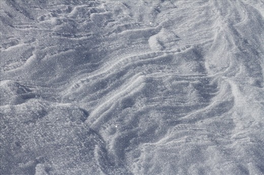 Hardened snow formations on a sunny winter's day. Karkonosze National Park.