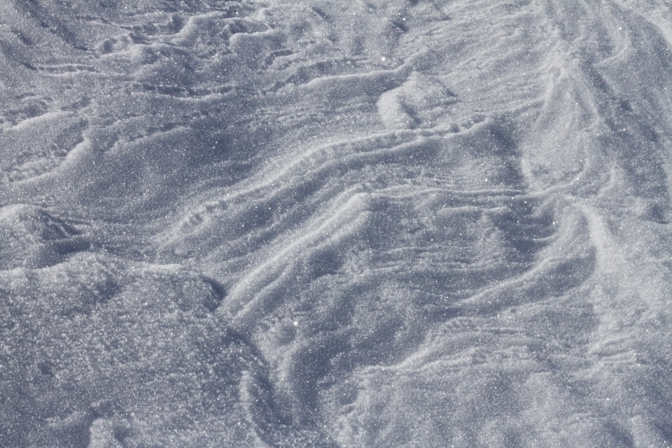 Hardened snow formations on a sunny winter's day. Karkonosze National Park.