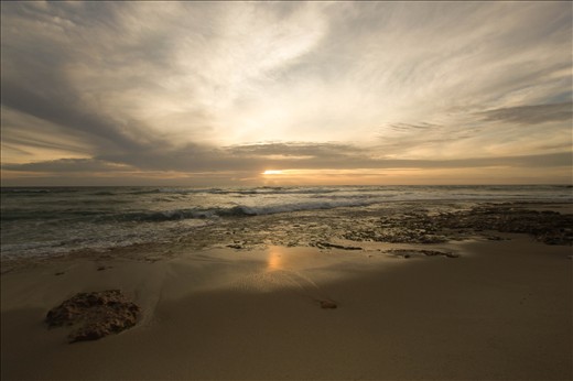 As the tide subsides, the sun makes her way to bed for the day