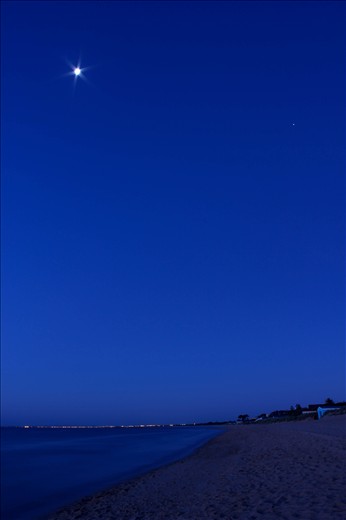 The moon takes her place in the sky, alongside Jupiter, amongst vivid blues