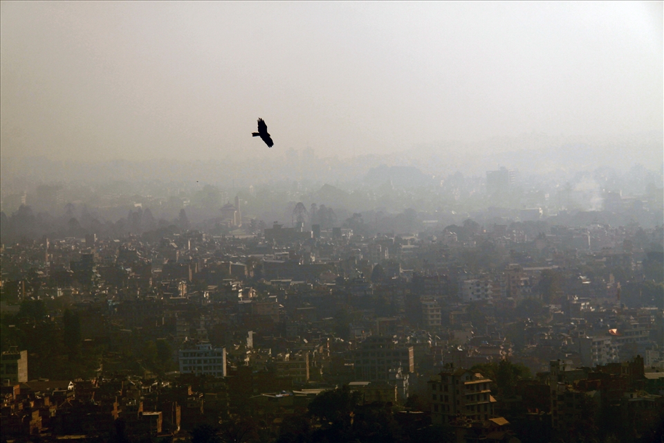 From the top of the Stupa, an eagle soars over the valley of Kathmandu.