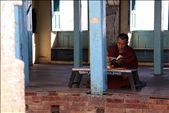 A buddhist monk sits quietly in chanted prayer amoungst the Stupa grounds.: by alixbrisley, Views[329]