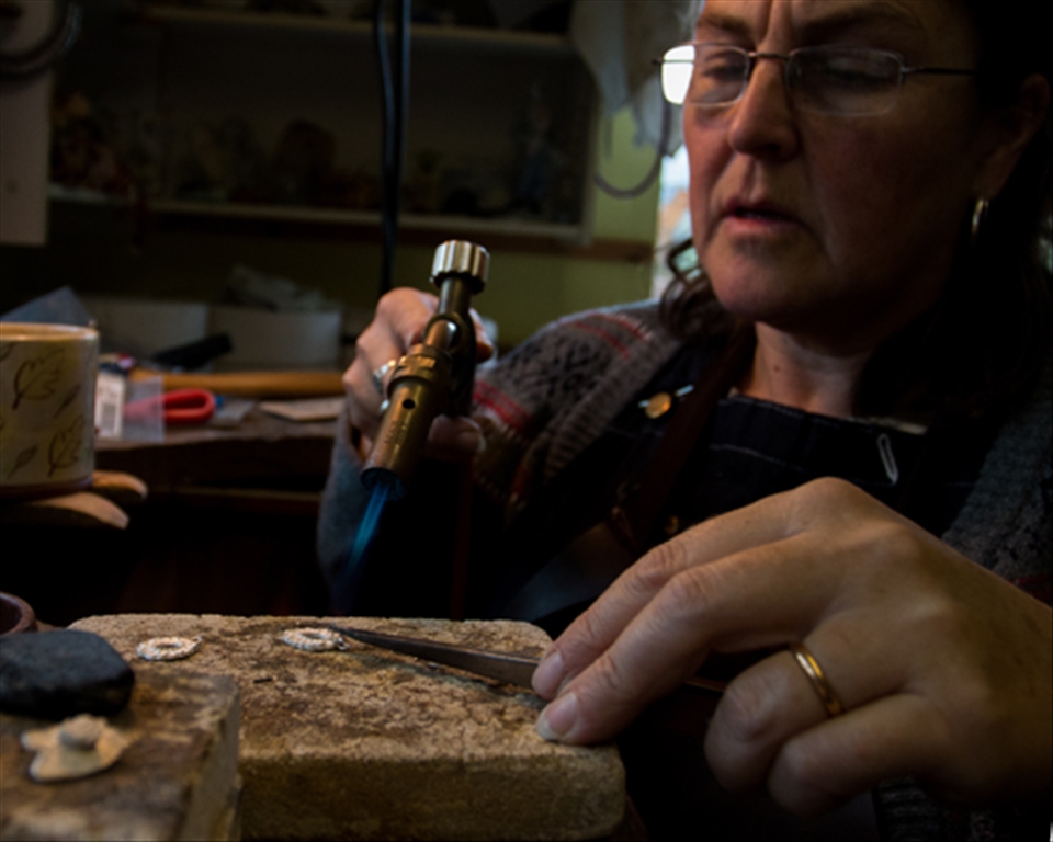The Jeweller continues to heat up the metal