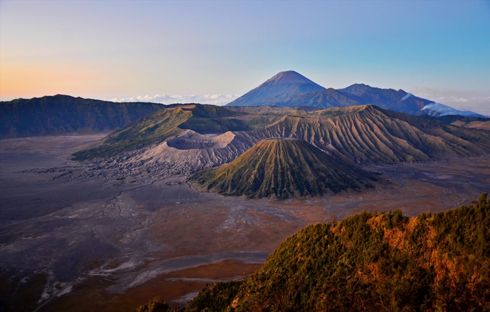 Bromo, an active volcano in East Java, Indonesia, is one of the most well-known tourist attractions in the country. The beautiful landscape encapsulates three mountains: Bromo (the crater), Batok (in the middle), and Semeru (the highest peak). 