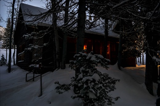 The warmth of the Bowers Cabin welcomes you from the road!