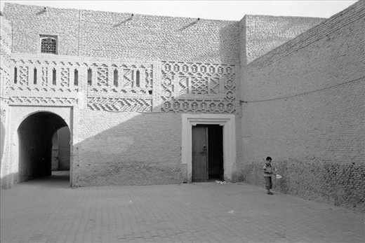 In the desert of the city, a child was playing alone