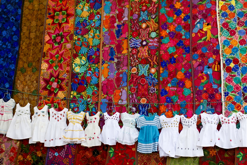 Dresses and Tapestry Laid out for Market