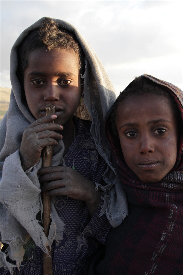 Girls working all day around  the cattle in the Simien Mountains. 