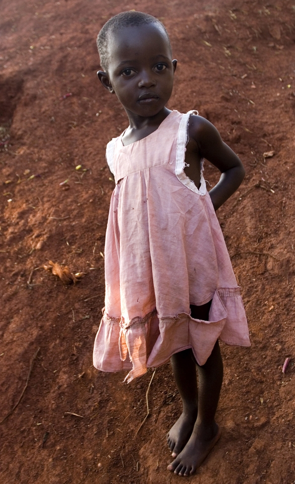 Barefoot girl with torn dress , I met her on a walk in Uganda, Africa. 