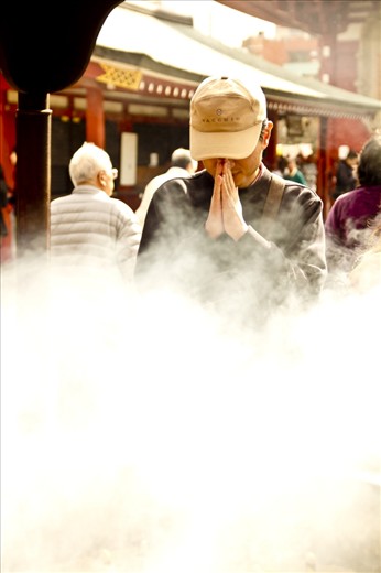 The temples and shrines are very important to the Japanese culture. I was lucky enough to be positioned behind the smoke in order to take this shot of a man praying.