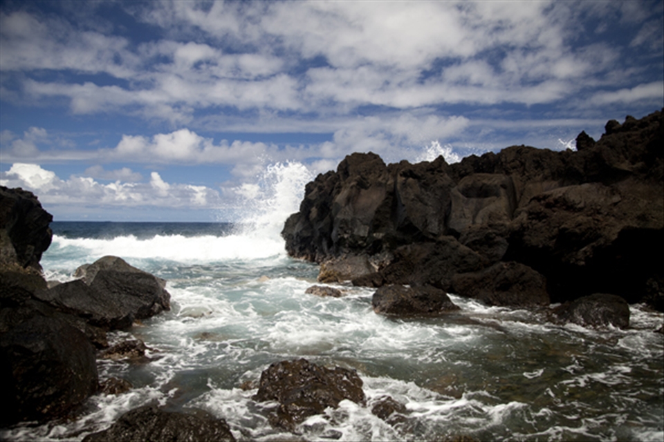 Beach of black lava rock on the west coast of Reunion