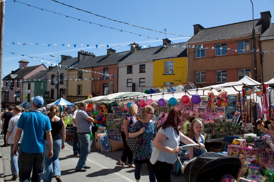 Gathering day at the Puck Faire draws families and vendors to the streets of Killorglin eager to experience Ireland's Oldest Faire. 