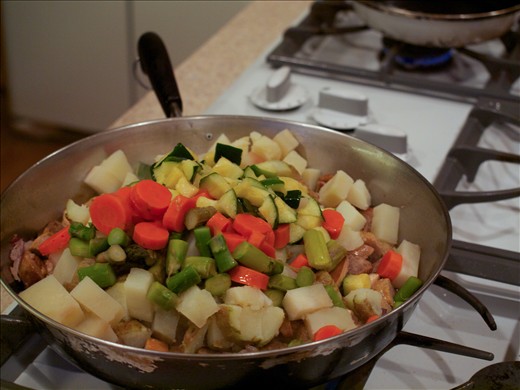 Add meat first, then potatoes, and the vegetables last. Toss together and heat until warm throughout.
