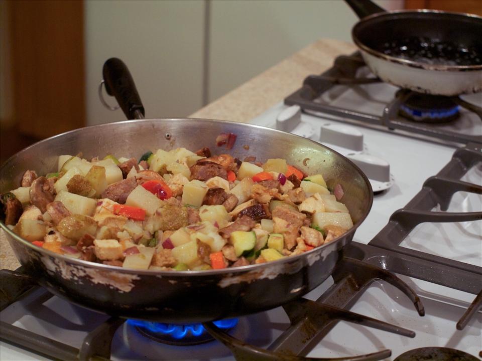 Fry eggs in separate pan while hash is warming & place on top when ready.