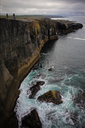 Waves crash against the cliffs of Ireland's Western coast.
