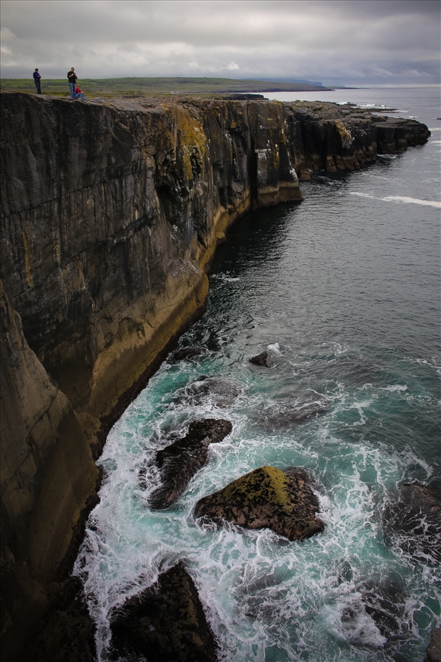 Waves crash against the cliffs of Ireland's Western coast.