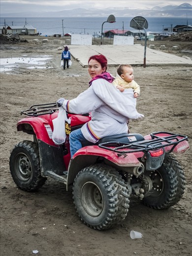 Heading home with the baby, Pond Inlet, Baffin Island, 2010