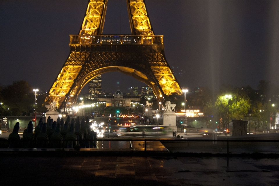 Paris at night the Eiffel Tower lit up to highlight the end of a perfect day.