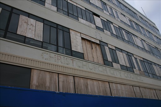 A city closed for business – 6 months after the February 2011 earthquake the Christchurch City Council offices were found to be structurally intact but missing stairways to carry workers between floors and their view blocked by the sheets of plywood replacing broken windows has left the building awaiting repair when its city needs it most.