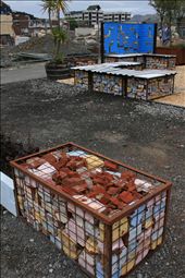 Urban construction oasis -  an inner city vacant lot left empty by a demolished building sees earthquake rubble and building ruins turned into an urban oasis of outdoor seating for meeting up with friends or reflecting on a city and lives lost.: by amyharro, Views[590]