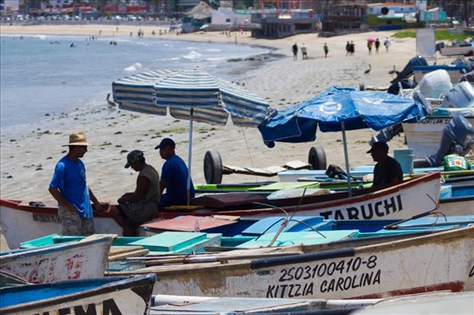Some fisherman spend the whole day working or just chatting with others.