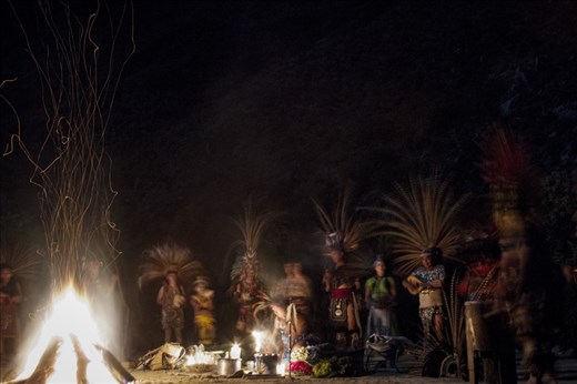 Traditional Aztec dancers from different backgrounds gather during the full moon of July, for the ceremonial dance of the jaguar, in a place surrounded by the majestic mountains of “La Huasteca” in Santa Catarina, Mexico. The aztec dance is a tradition that remains alive and has been transmitted through many generations.