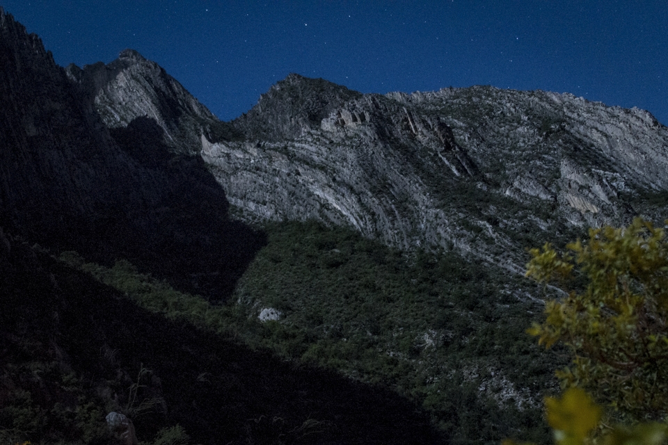 When the full moon reaches a certain point in the sky, it projects some shadows over the mountains forming the profile of a jaguar, Panthera Onca, accompanying the rituals of intense dance.