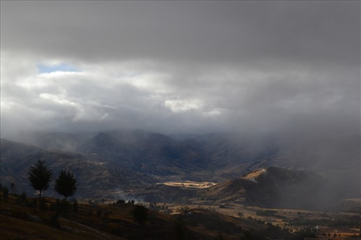Clouds giving way to Quilotoa's awe-inspiring view.