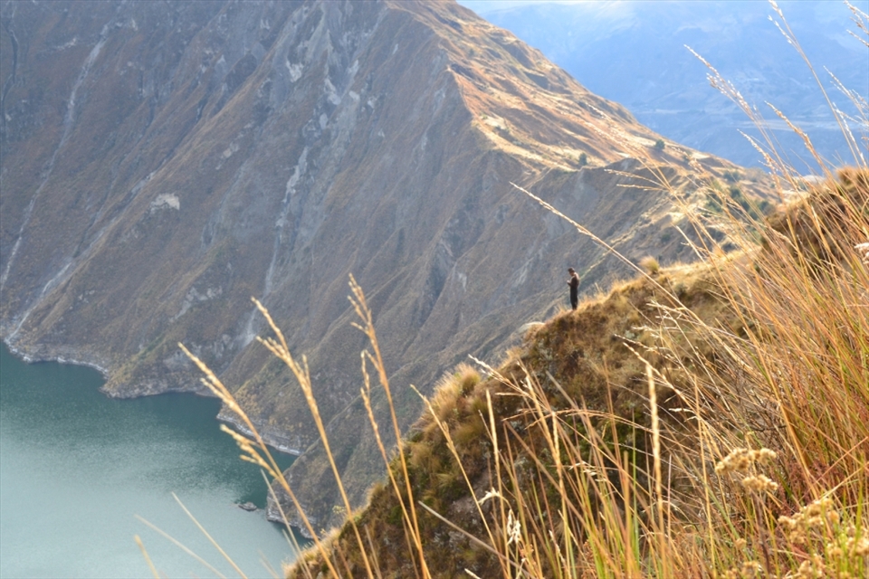 A man native to the land, looking into heaven's emerald mirror.