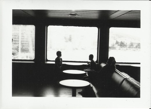 On the ferry-boat to Sicily. The Captain’s family is looking out of the window. Giuseppe points out another boat.