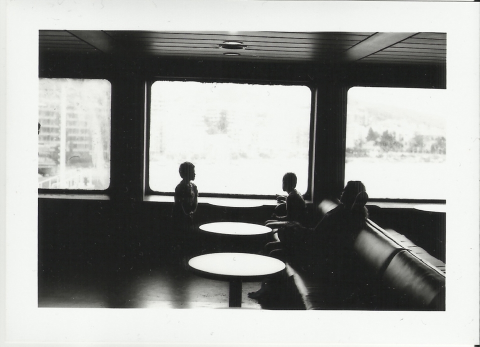 On the ferry-boat to Sicily. The Captain’s family is looking out of the window. Giuseppe points out another boat.