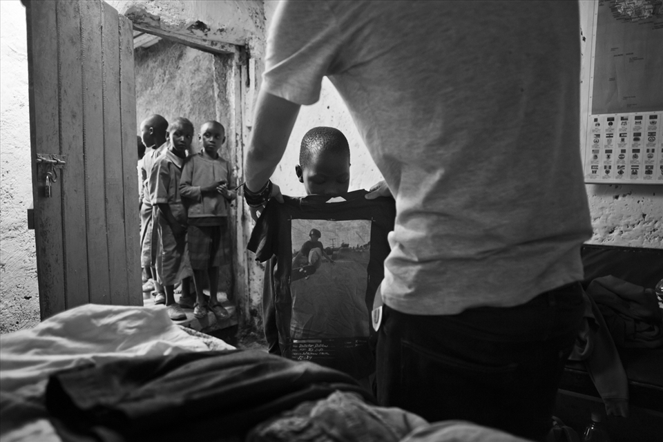 Volunteers donate clothing to the most needy children at Melon Chosen Community.